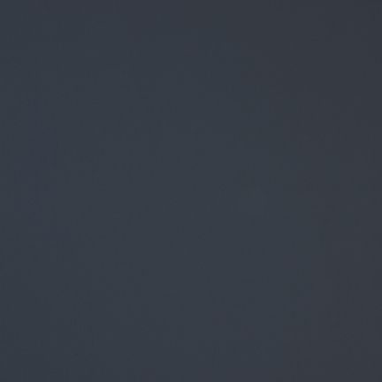 A smooth, dark gray surface with subtle texture.