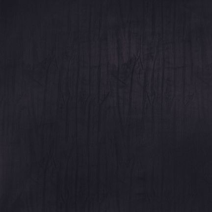 Dark textured surface with subtle vertical streaks.