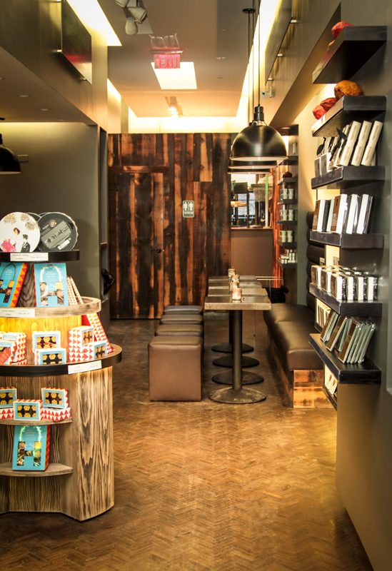 Cozy bookstore corner with wooden shelves and warm lighting.