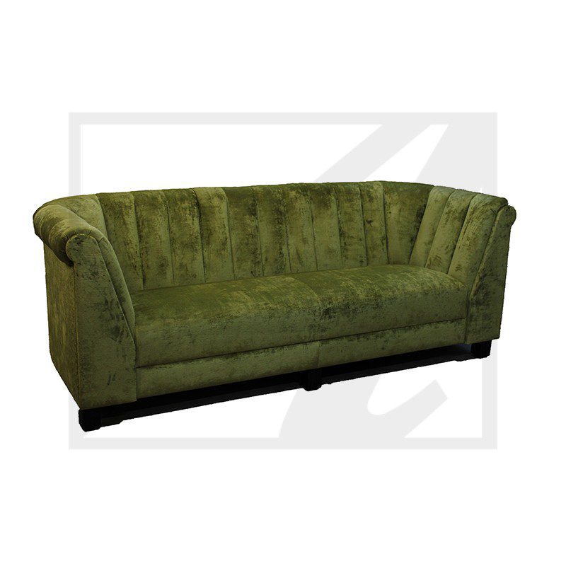 Green velvet curved sofa with black base.