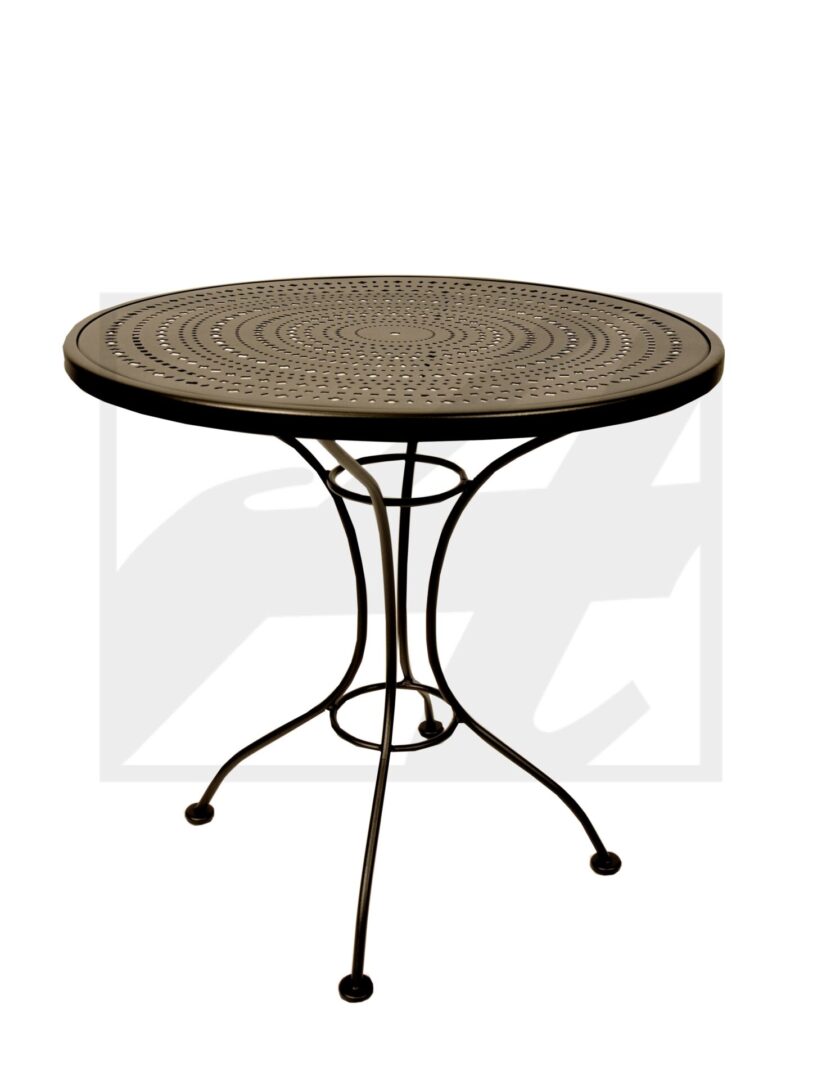 Round metal table with intricate top and three curved legs.