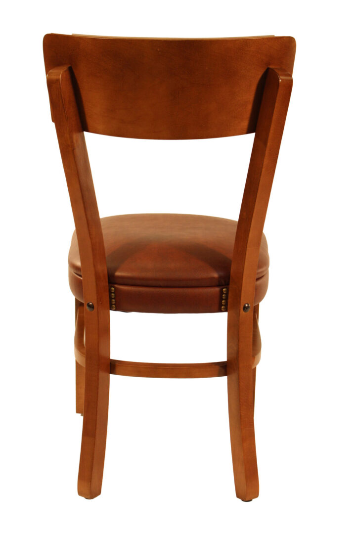 Wooden chair with a cushioned seat photographed from the back.