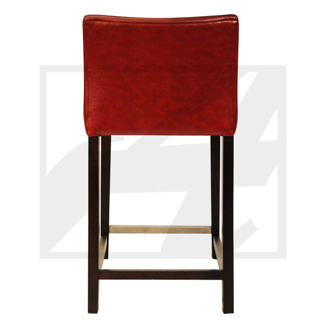 Red upholstered bar stool with dark wooden legs.