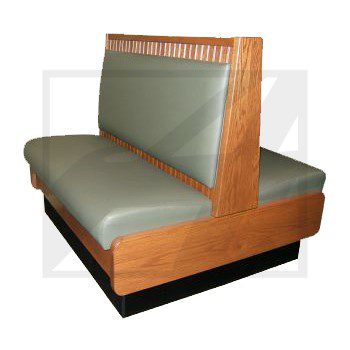 Double-sided wooden booth seating with green upholstery.