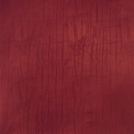 Close-up of a textured deep red fabric with subtle vertical lines.