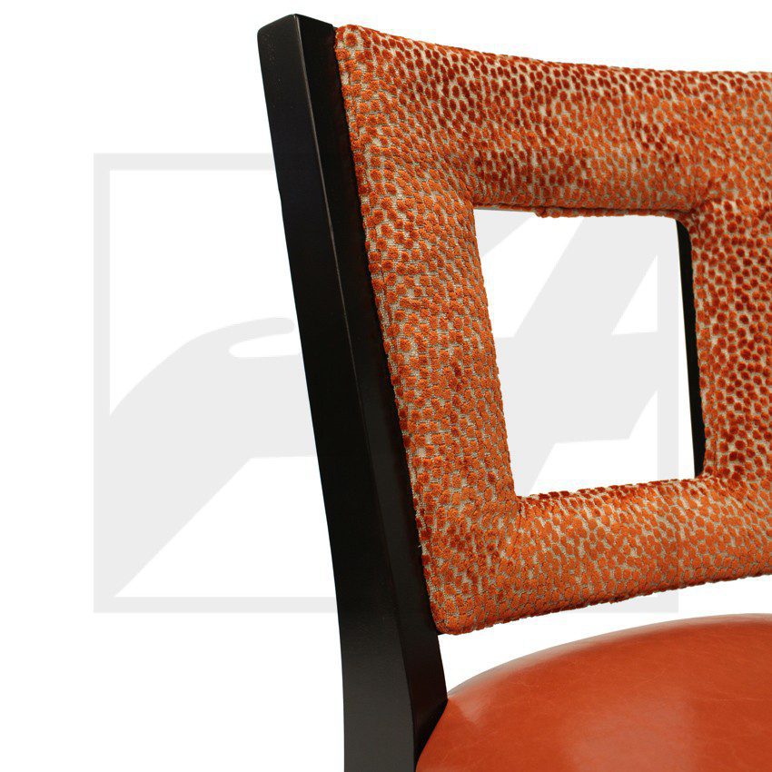 Brown leather chair with a textured backrest and wooden frame.