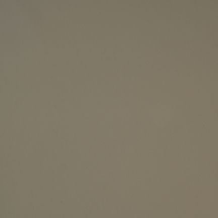 A plain, solid taupe-colored surface with no distinct features.