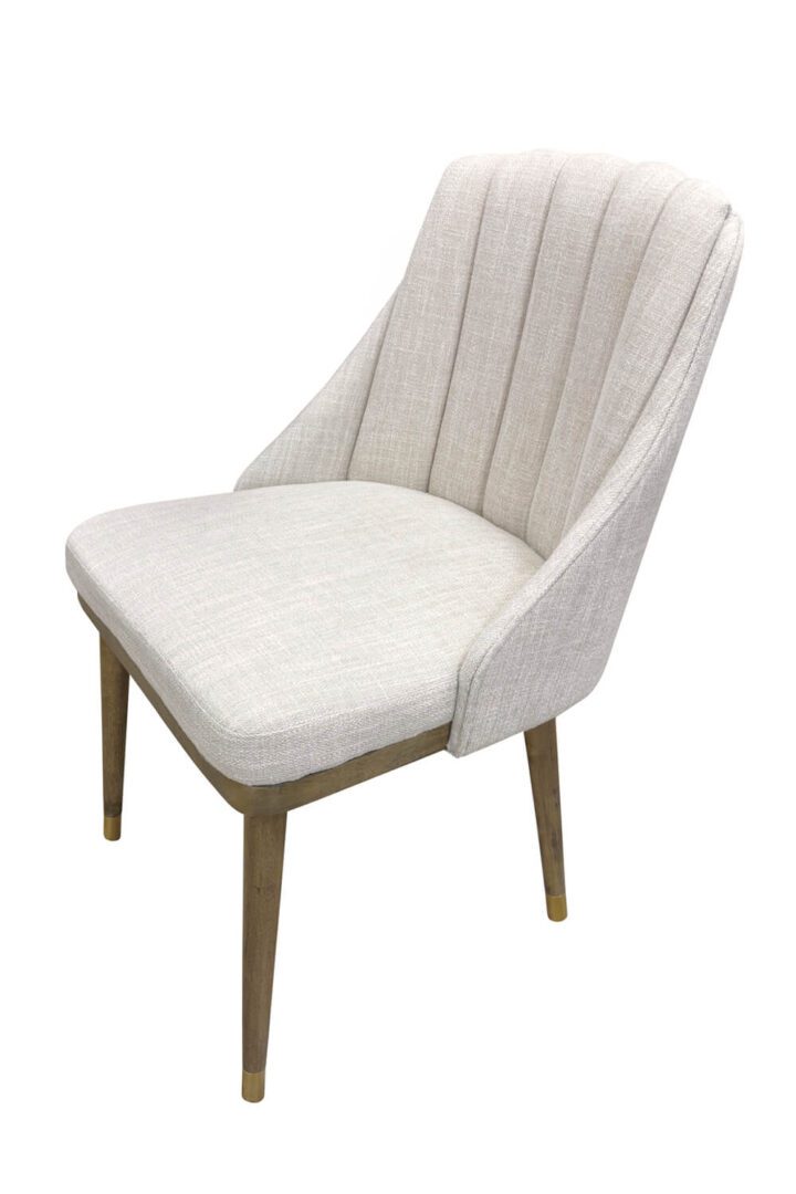 Modern white upholstered dining chair with wooden legs.