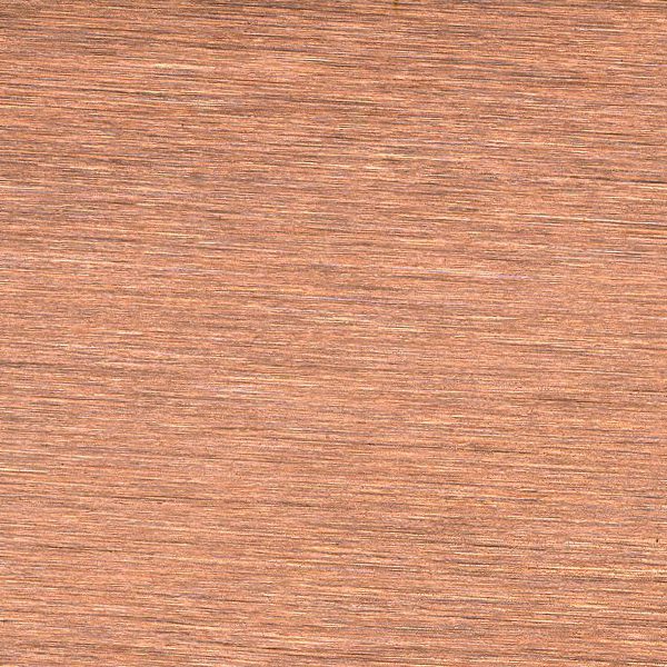 Close-up of polished copper metal surface with natural texture.