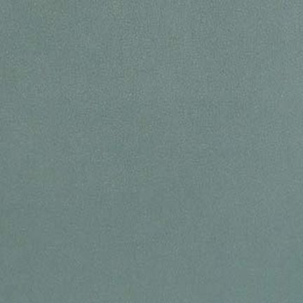 A textured teal surface with a subtle, uniform pattern.
