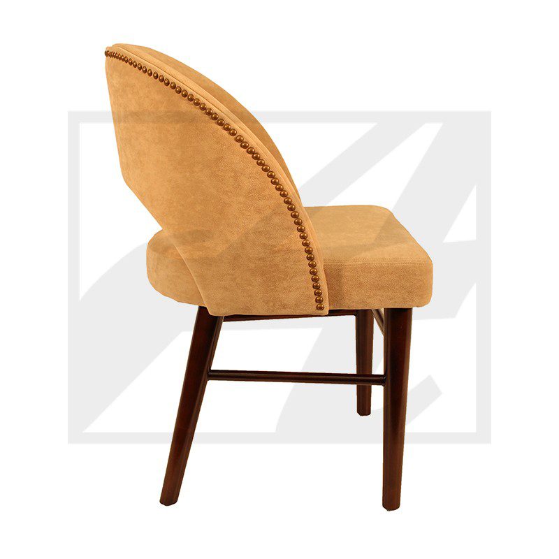 A stylish tan upholstered chair with wooden legs and a curved backrest.