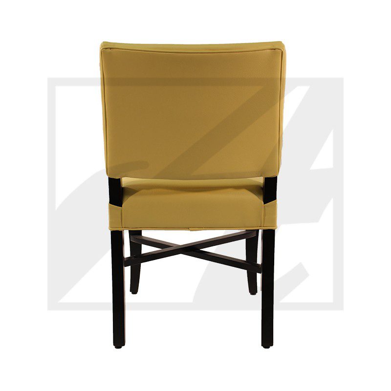 Rear view of a mustard yellow chair with black legs and crossbars.