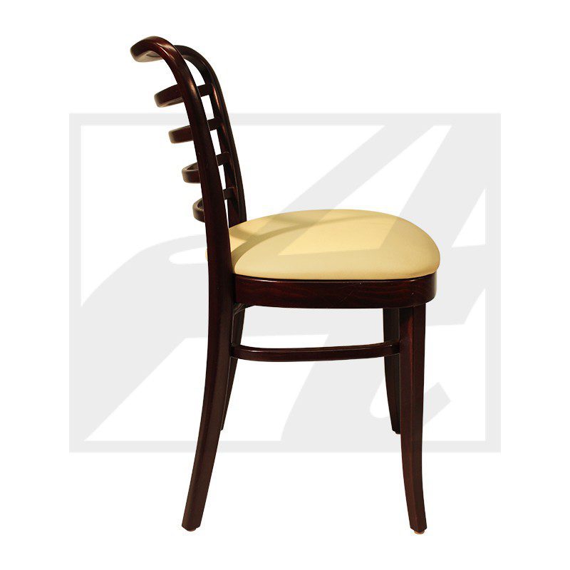 Side view of a wooden chair with a cushioned beige seat and curved backrest.