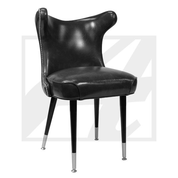 Black leather chair with mid-century modern design and tapered legs.