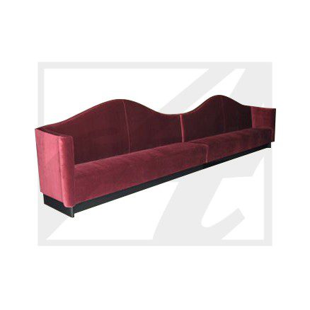 Elegant red upholstered bench with curved backrest and armrests.