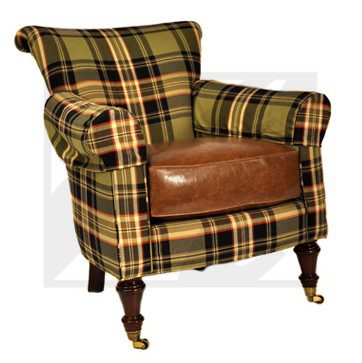 Plaid upholstered armchair with leather seat and wooden legs.