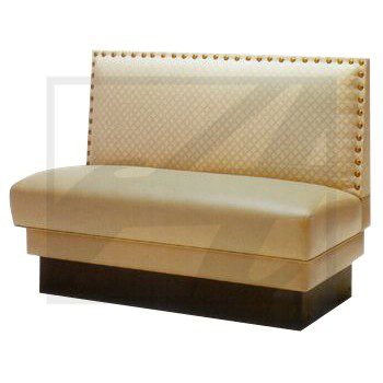Beige leather bench with nailhead trim and dark base.