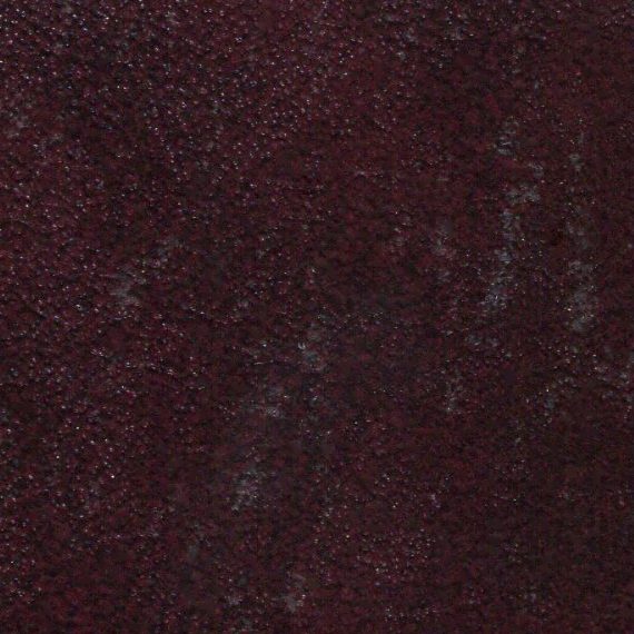 Close-up of dark maroon textured surface.