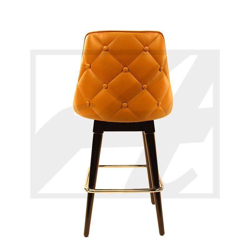 Orange cushioned bar stool with wooden legs and footrest.