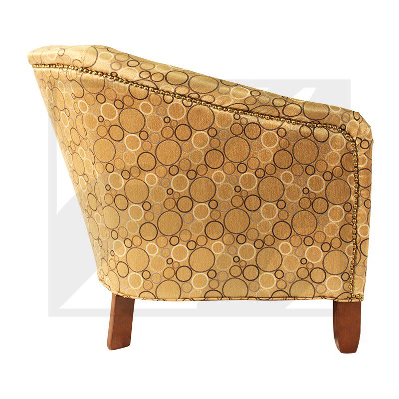 Brown patterned armchair with wooden legs.