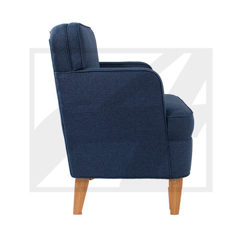 Side view of a navy blue upholstered armchair with wooden legs.