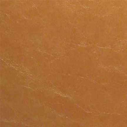 Close-up of a smooth brown leather surface with natural texture.