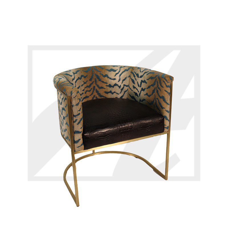 Elegant tiger-print barrel chair with gold metal frame and black cushion.