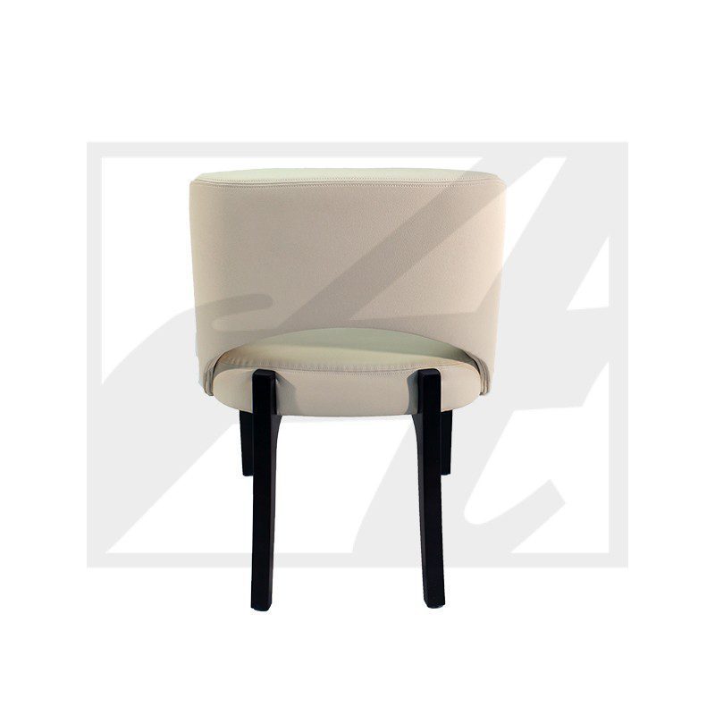 Beige ottoman with black legs, viewed from below.