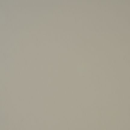 Plain beige wall with no distinct features.