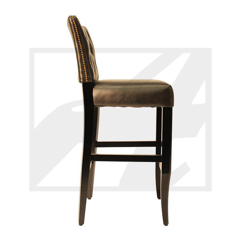 Side view of a brown cushioned bar stool with wooden legs.