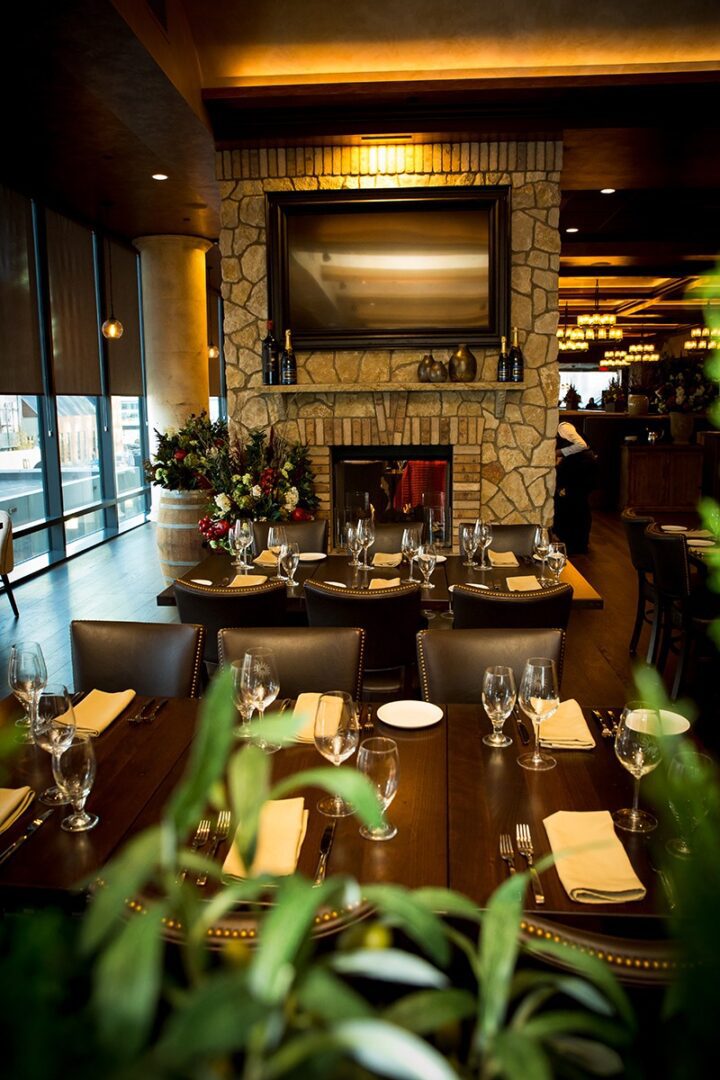 Cozy restaurant dining area with elegant table settings and warm lighting.