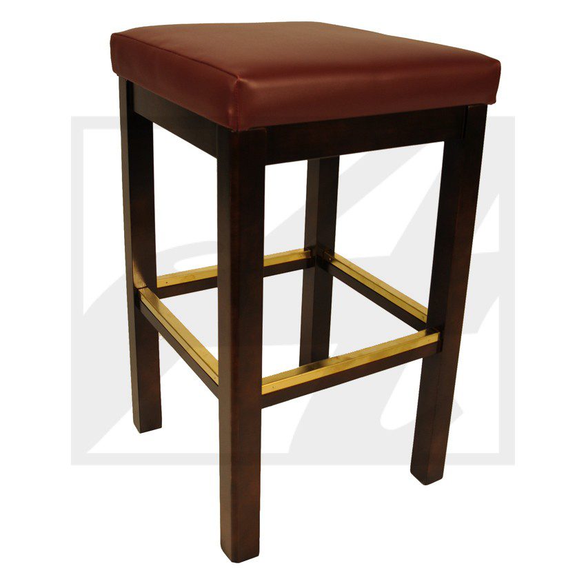 Wooden bar stool with a padded red seat and brass footrest.