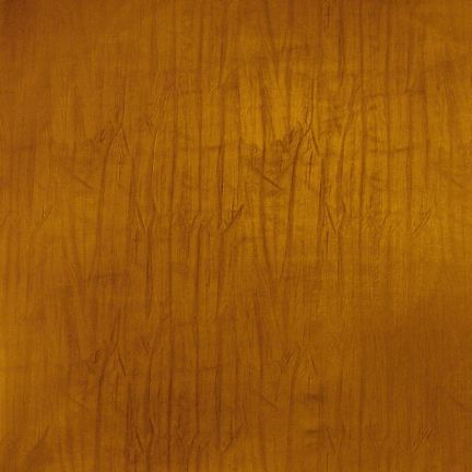 Close-up of a wooden surface with a smooth finish and visible grain patterns.