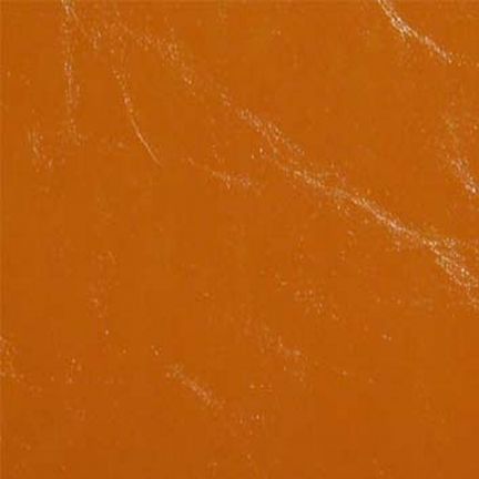 Close-up of an orange surface with subtle white scratches.