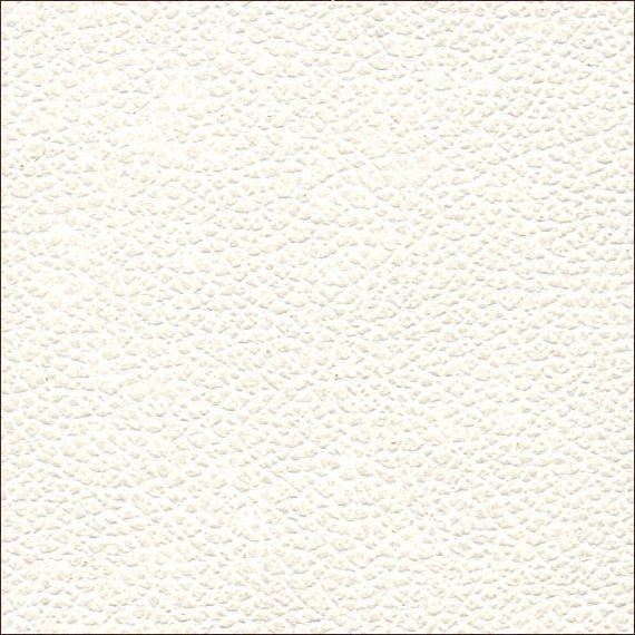 Close-up of a textured white surface with subtle patterns.