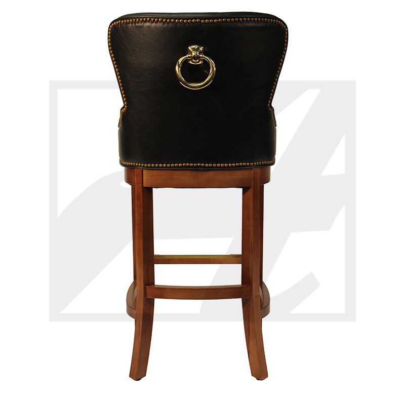 A wooden bar stool with a black cushioned backrest and brass ring handle.