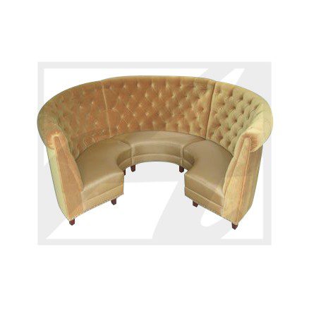 Curved beige tufted sofa with two matching armchairs.