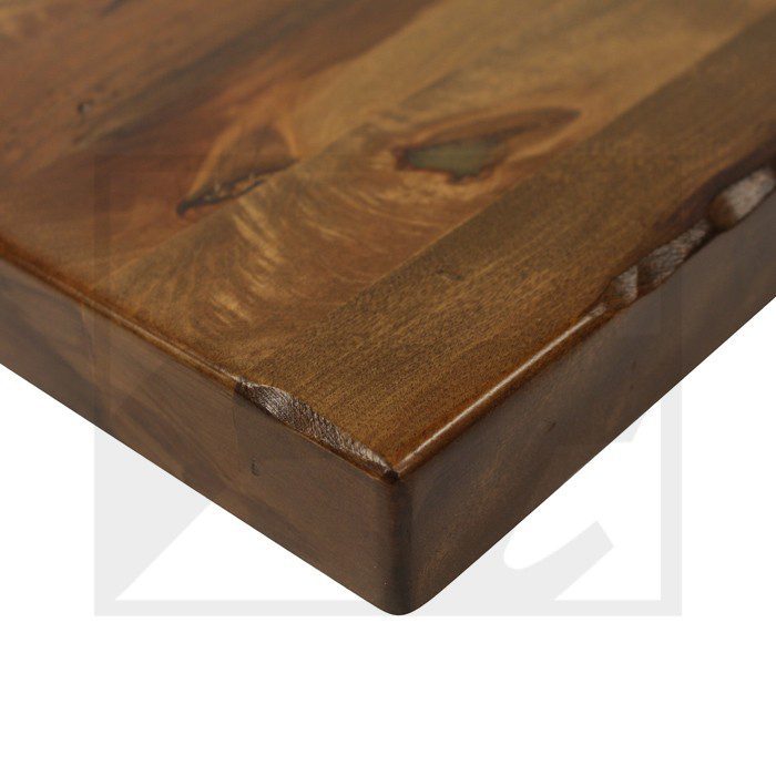 Close-up of a wooden table corner with rich grain and smooth finish.